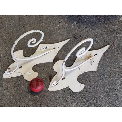 838 - A pair of charming metal garden plant hangers. In a cream finish.