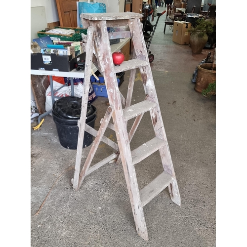 840 - A vintage four-step wooden A-form ladder. H150cm folded.