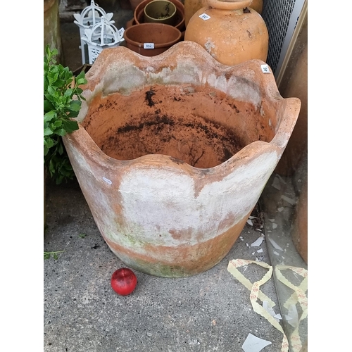 846 - A huge terracotta planter with a scalloped edge. Barely noticeable losses to rim. H55cm These large ... 