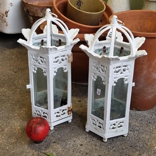 851 - A wonderful pair of cast metal lanterns with glass panels and a white finish. Small loss to one pane... 