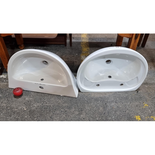 870 - Two as new high quality ceramic bathroom sinks.