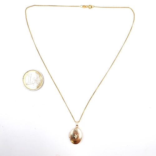 892 - Star Lot : An elegant 9K gold necklace with a diamond set 9ct locket pendant, total weight 2.41, len... 