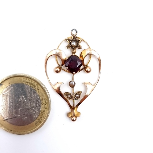 894 - Star Lot : A beautiful art nouveau  9K gold an garnet and pearl set necklace pendant featuring a del... 