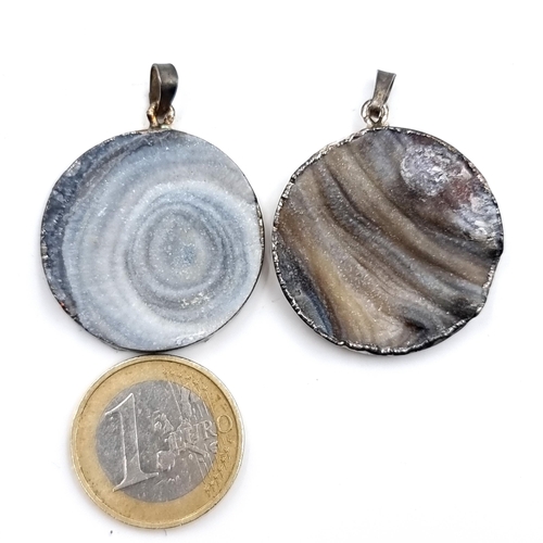 926 - A collection of two quartz circular pendants with sterling silver surrounds, dimensions 3cm diameter... 