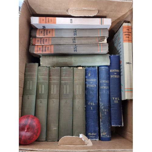 942 - A box containing a number of antique and early 20th century hard back books including examples such ... 