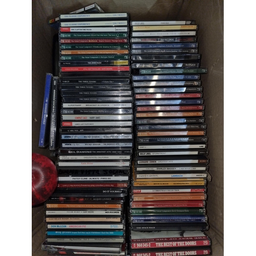 944 - A box containing a huge number of CDs in a variety of music genres such as rock, classical, and jazz... 