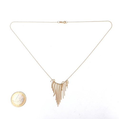 963 - An unusual 9K gold beaded fringe necklace, weight 2.46 grams, length 40cm, with lobster clasp.