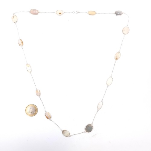 965 - An elegant sterling silver necklace boasting opal and white onyx gem stones, total weight 15.3 grams... 