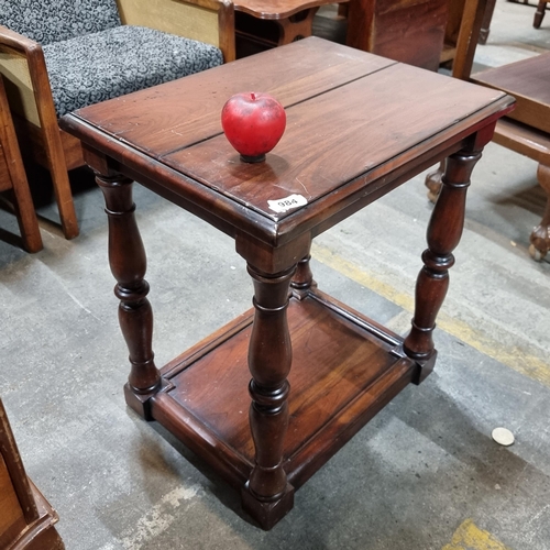 984 - A handsome side table with turned legs and a shelf to base.