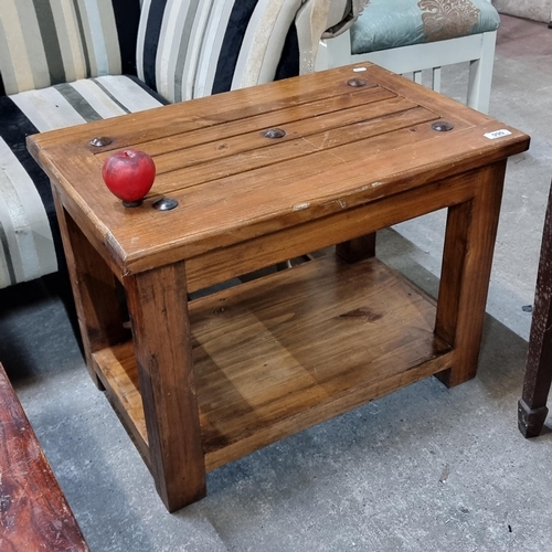 990 - A well made solid wood nicely sized coffee table with button detail to top and under storage.