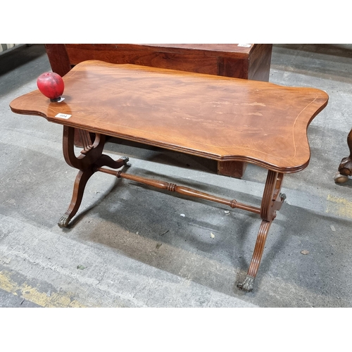 994 - A beautiful vintage coffee table with scroll edge, string inlay, mandolin detailing to base and bras... 