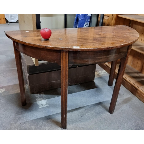 996 - An elegant 19th Century mahogany demilune table.