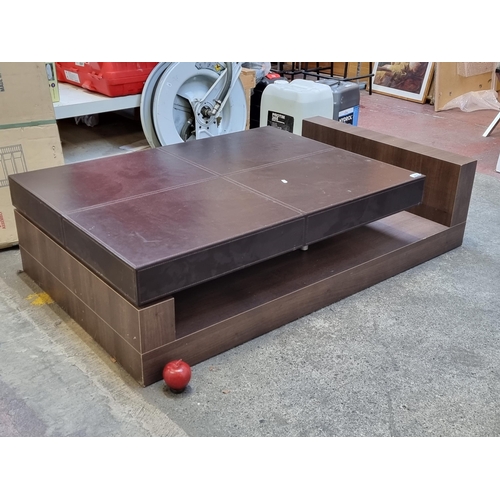 997 - A stylish and contemporary large coffee table, this high quality piece features a chocolate brown le... 