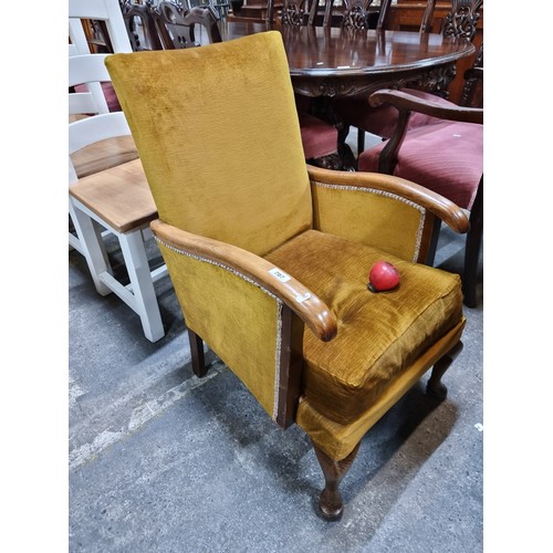 707 - A delightful vintage Mid Century Modern armchair with high back, polished wooden armrests, comfortab... 