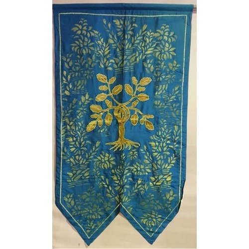 587 - A large heraldic banner with an  tree of life emblem. In shades of golden and turquoise.