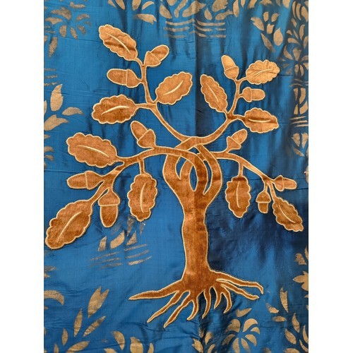 587 - A large heraldic banner with an  tree of life emblem. In shades of golden and turquoise.