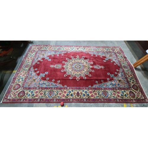 971 - Star Lot :  A very large striking beautiful  hand knotted woolen rug boasting a floral design in sha... 