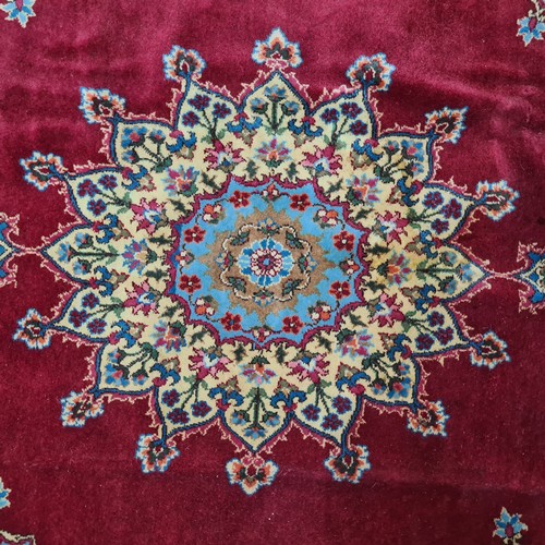 971 - Star Lot :  A very large striking beautiful  hand knotted woolen rug boasting a floral design in sha... 