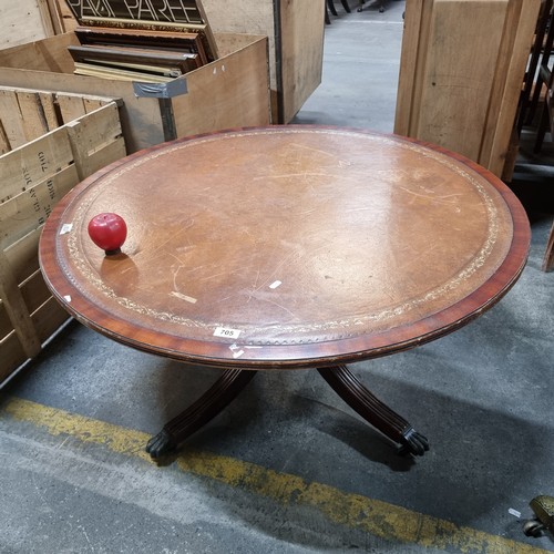 705 - Star lot: An antique Regency style round coffee table with splayed and reeded legs terminating in br... 