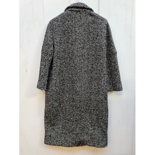 234 - Star Lot - A superb brand new ladies Dolce & Gabbana double breasted herringbone tweed coat with inn... 