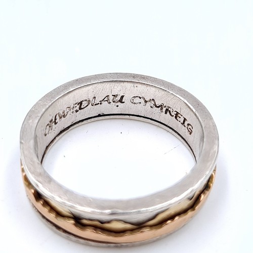 506 - A gents Lord of the rings,  9K gold and silver ring, ring size T, weight 7.88 grams.