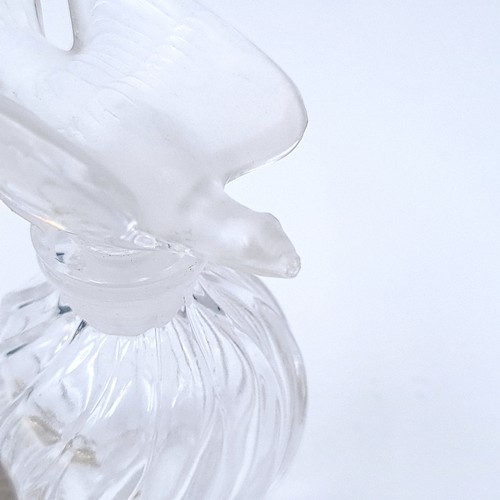 520 - A cut glass swirl design perfume bottle by lalique set with a bird design stopper. dimensions 9cm x ... 