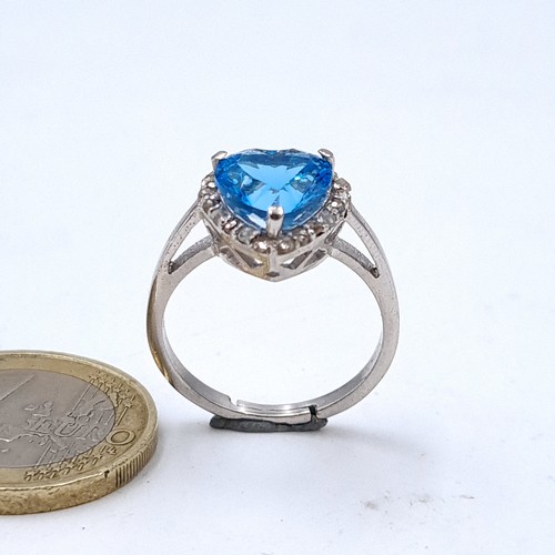 546 - Star Lot : A really beautiful blue topaz heart shaped ring with diamond surround, topaz 8.75 cts, di... 