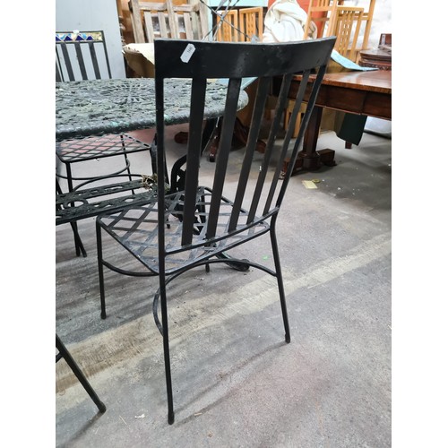 843 - Star Lot : A fabulous five piece vintage heavy cast iron garden table accompanied by a set of four c... 