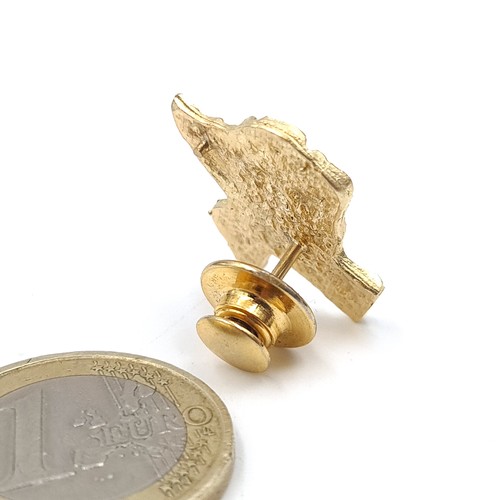 887 - Star Lot :A 14k gold Texas Gold nugget with brooch clip, total weight 4.42 grams.