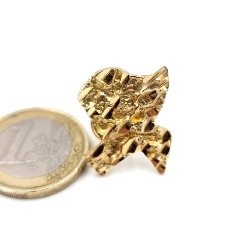 887 - Star Lot :A 14k gold Texas Gold nugget with brooch clip, total weight 4.42 grams.