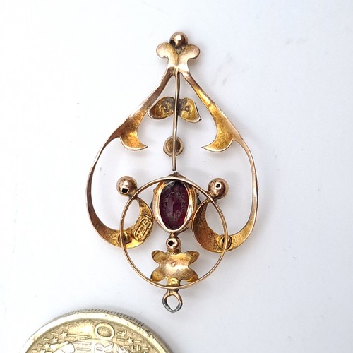 894 - Star Lot : A beautiful art nouveau  9K gold an garnet and pearl set necklace pendant featuring a del... 