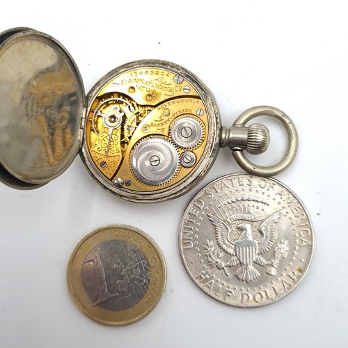 910 - Two items including a 1964 90%  silver USA half dollar coin and  a vintage Elgin pocket watch.