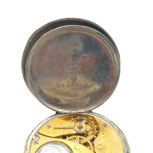 910 - Two items including a 1964 90%  silver USA half dollar coin and  a vintage Elgin pocket watch.