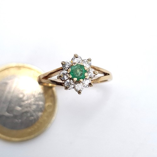 951 - Star lot : A 9K gold ring with a raised mount featuring an emerald with a gem set floral cluster, ri... 