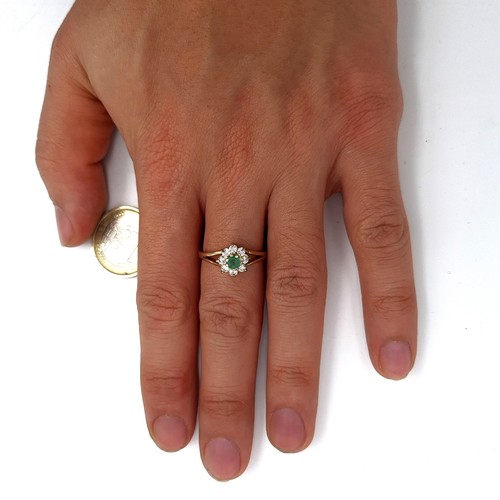 951 - Star lot : A 9K gold ring with a raised mount featuring an emerald with a gem set floral cluster, ri... 