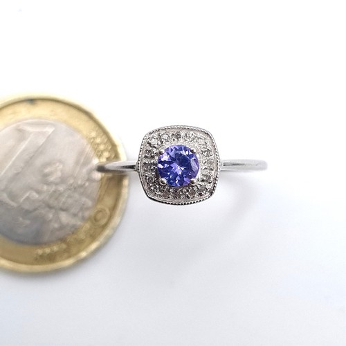 957 - Star Lot : A stunning 9k white gold Tanzanite set ring with a diamond surround, ring size L, weight ... 