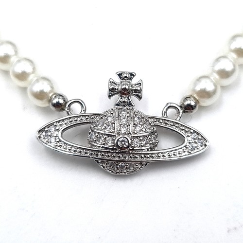 964 - A stunning pearl necklace by Vivienne Westwood featuring a gem set emblem pendant with presentation ... 