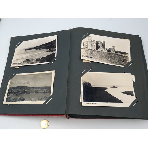 26 - A vintage photograph album, mostly in black and white covering mostly Cork, Kerry and Galway, collec... 