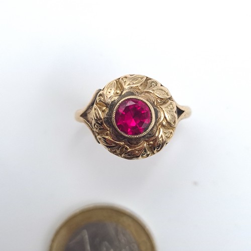 554 - A striking 9K gold antique ruby stone ring set with shell design mount, size N 1/2, weight 4.2 grams... 