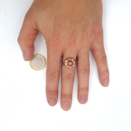 554 - A striking 9K gold antique ruby stone ring set with shell design mount, size N 1/2, weight 4.2 grams... 