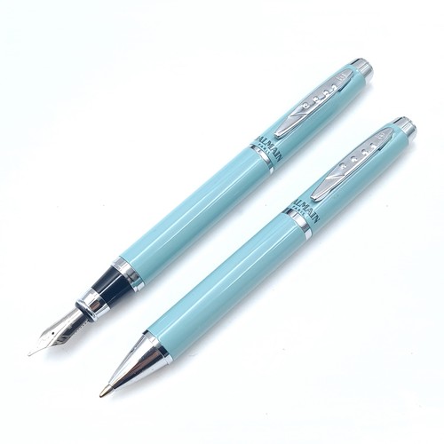 558 - Star Lot : A writing set by Balmain Paris consisting of a Fountain pen and biro with turquoise body ... 