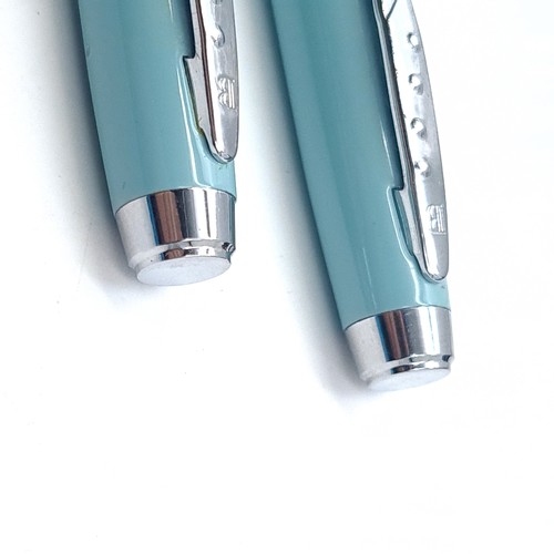 558 - Star Lot : A writing set by Balmain Paris consisting of a Fountain pen and biro with turquoise body ... 