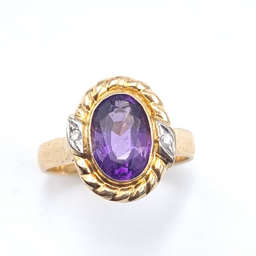 559 - Star Lot : An outstanding 14K gold stamped to band amethyst and diamond ring with scroll relief moun... 