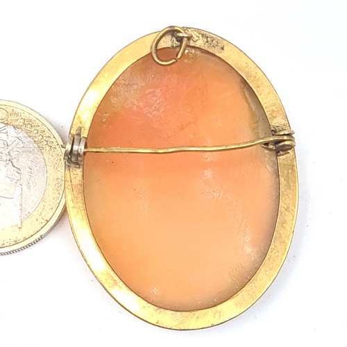 903 - An elegant carved shell cameo brooch/necklace pendant depicting the virgin Mary, pin still intact.