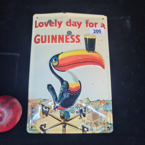 200 - A Guinness metal advertising sign featuring the iconic toucan.