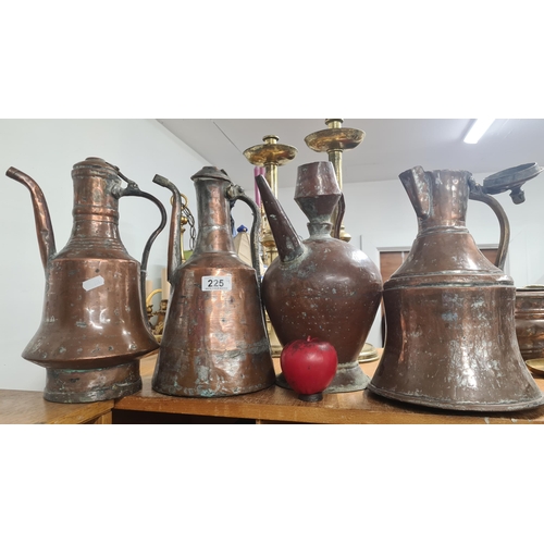 225 - Four striking antique copper pots in various shapes.