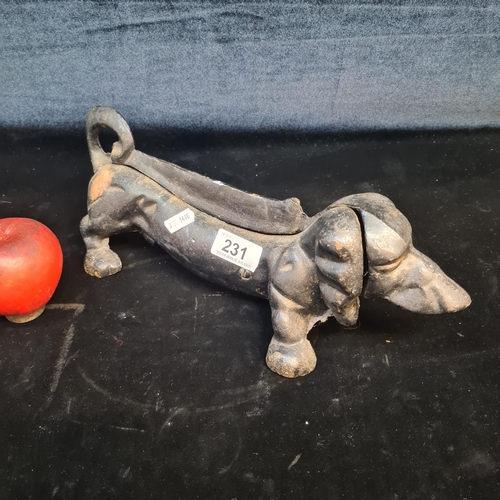 231 - A heavy cast iron dachshund boot scraper.