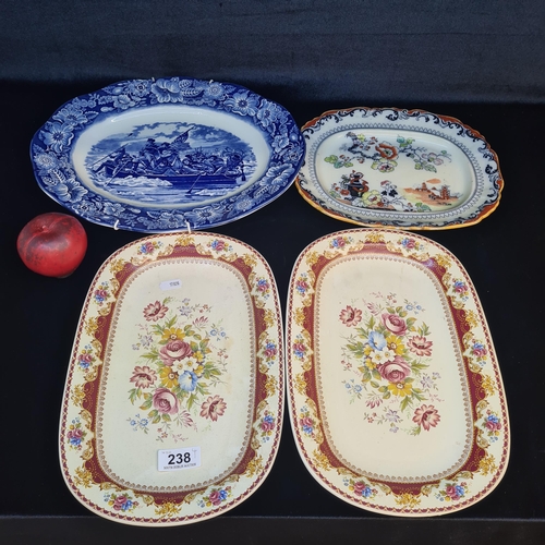 238 - A selection of four ornate vintage platters featuring lovely floral designs. Including examples from... 