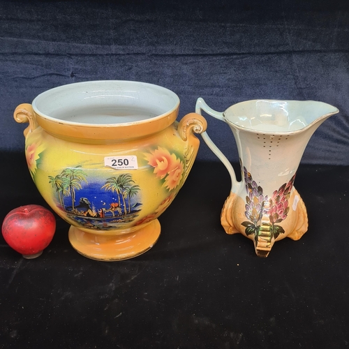 250 - Two vintage ceramic items including an Art Deco pitcher from Kensington Ware featuring a lustre effe... 