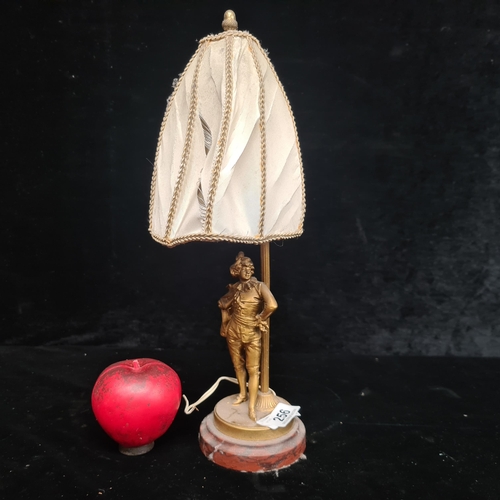 256 - An elegant vintage table lamp with a sculptural brass base and fabric sail-like shade.